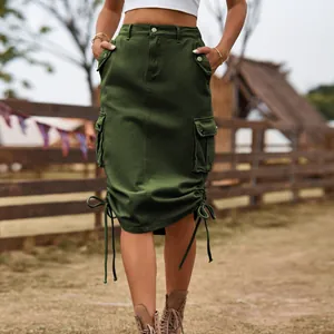 Detailed view of dark green cargo denim midi skirt with side pockets and hem drawstrings