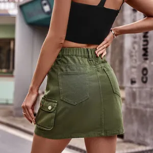 Close-up view of an olive green denim cargo mini skirt with elastic waist and side pockets