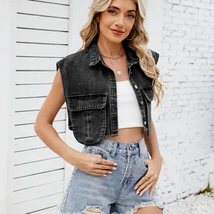 Detailed view of a stylish washed black denim cropped vest with pockets on a female model