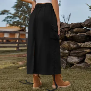 Back view of a chic black denim cargo midi skirt featuring slit and pocket details