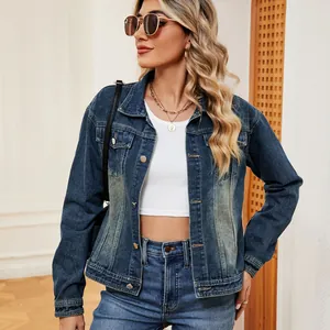 Detailed lifestyle shot of a women's vintage washed blue denim jacket worn by a model.