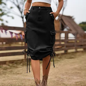 Detailed view of a black denim cargo midi skirt with adjustable drawstring hem and pockets.