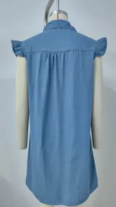Back view of a light blue washed denim sleeveless dress with ruffled shoulder details.