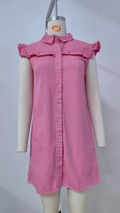 Front view of a pink washed denim sleeveless shirt dress with ruffle details on sleeves