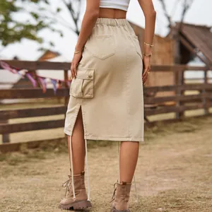Back view of a khaki cargo denim midi skirt featuring side slit and drawstring details