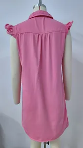 Back view of a pink washed denim sleeveless dress showing ruffle shoulder details