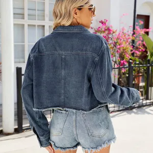 Detailed back view of a cropped washed denim jacket with stylish frayed edges and a casual fit