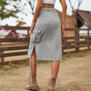 Back view of a grey denim cargo midi skirt with side pocket and drawstring detail