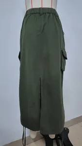 Back view of a casual olive green cargo midi skirt with a high waist and stylish slit