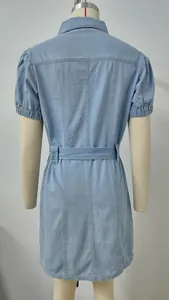 Detailed back view of a light blue washed denim shirt dress with a waist belt