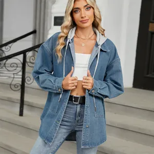 Detail view of washed loose denim jacket with grey hood for women's street style.
