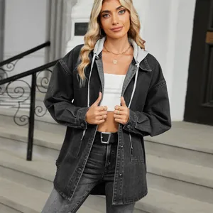Detail shot of a casual hooded denim jacket in washed grey worn by a female model.