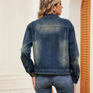 Back view of a casual washed denim jacket with long sleeves on a blonde model