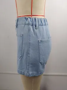 Side detail of light blue washed denim shorts featuring elastic waist and front pockets
