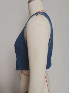 Detailed side profile of a vintage washed blue denim slim-fit vest with V-neck