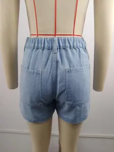 Detailed back view of women's light blue washed denim shorts on a tailor mannequin