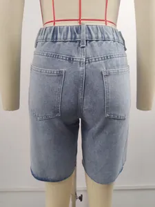Detailed back view of vintage light blue denim shorts featuring elastic waist and pockets
