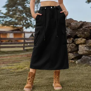 Close-up detail of a black cargo denim midi skirt with drawstring waist and pockets.