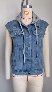 Close-up detail of washed denim hooded vest with drawstring and metal buttons for women