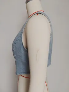 Detailed side view of retro light blue slim fit V-neck denim vest with washed finish
