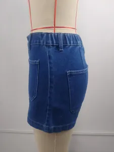 Detailed side view of washed blue denim shorts showing pocket and elastic waist