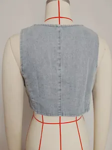Close-up detailed back view of a light wash vintage denim vest on a tailor mannequin.