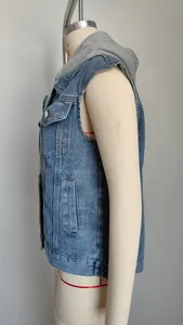 Side view of women's classic washed denim vest with grey jersey hood on a mannequin