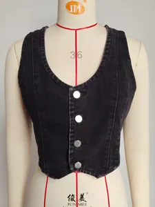 Close-up of retro washed black denim vest with V-neck and metal buttons.