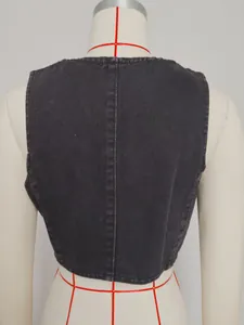 Back view of a washed black denim slim-fit vest displayed on a tailor mannequin.