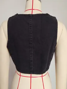 Close-up back view of a vintage American-style slim-fit washed black denim vest