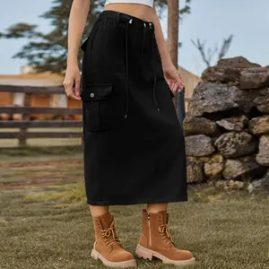 Detail of a black cargo midi denim skirt with drawstring waist and side pockets.