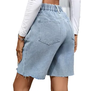 High-waisted light blue denim Bermuda shorts with retro raw edges and back pockets