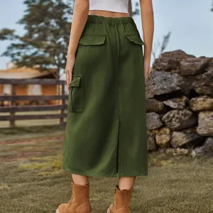 Back view of a green washed cargo denim midi skirt with flap pockets and back slit.