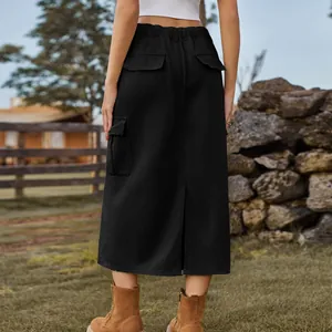 Back view of a black cargo denim midi skirt with pockets and elastic waist in nature.
