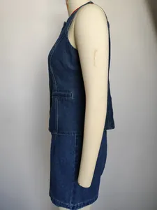 Detailed side view of women's sleeveless washed blue denim vest and shorts two-piece set