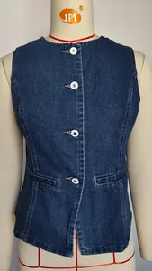 Detail view of a classic blue washed sleeveless denim vest with front button closure