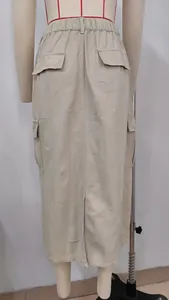 Detailed back view of khaki cargo denim midi skirt on mannequin showing pocket details