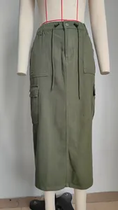 Army green cargo denim maxi skirt with drawstring waist and large side pockets detail view.