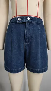 Close-up detail of women's high waisted dark blue washed denim shorts with silver buttons