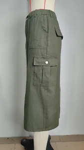 Detail of olive green cargo midi skirt with functional side pockets and elastic waist