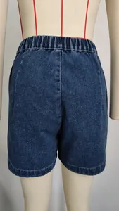 Back view detail of high-waisted denim shorts with elastic waistband on mannequin