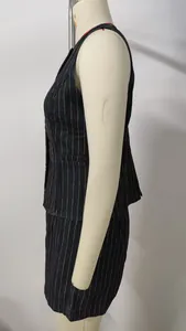 Side view of a dark wash pinstripe denim vest and matching shorts set on a mannequin