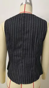 Rear view of a slim-fit dark denim pinstripe vest on a tailor mannequin