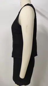 Side view of black denim sleeveless vest and matching shorts set displayed on mannequin