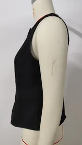 Detailed side profile of a black washed sleeveless denim vest displayed on a mannequin