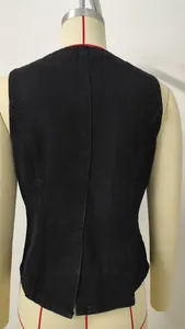 Close-up back view of a black washed denim vest on a professional tailor mannequin