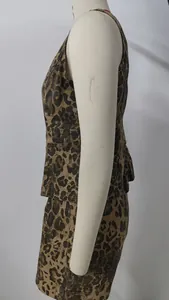Side profile view of a leopard print sleeveless denim vest and shorts set on a mannequin