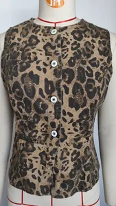 Close-up of leopard print denim vest with white buttons on mannequin