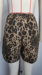 Detailed back view of women's leopard print denim shorts with elastic waistband.
