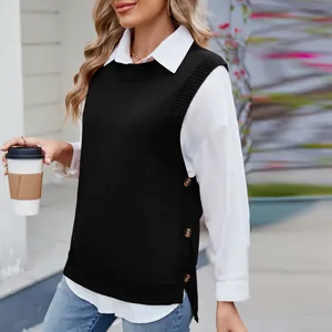Close-up of black knit sweater vest with decorative side buttons and side slit detail